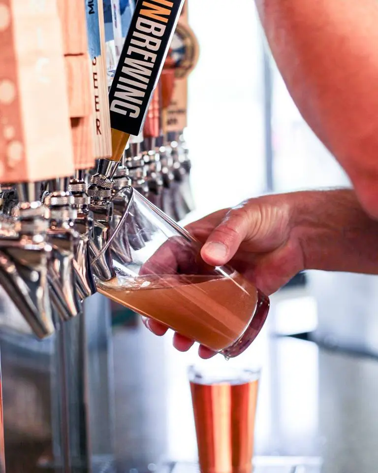Pouring beer from tap